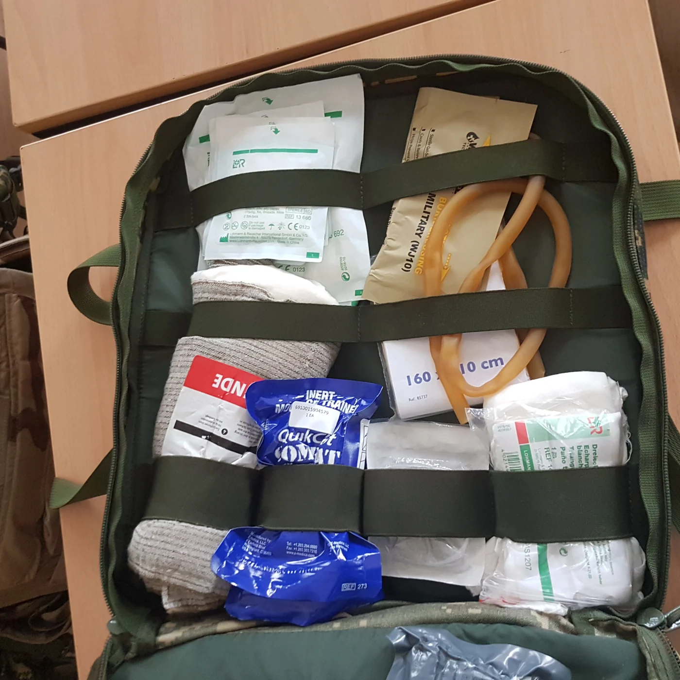 Open unit medical bag with dressings, tourniquets and haemostatic gauze